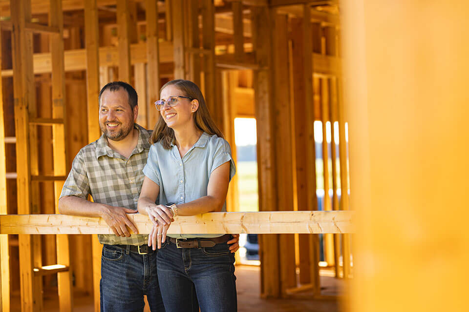 Rural Ohio couple stand in home financed by Rural 1st construction loan.