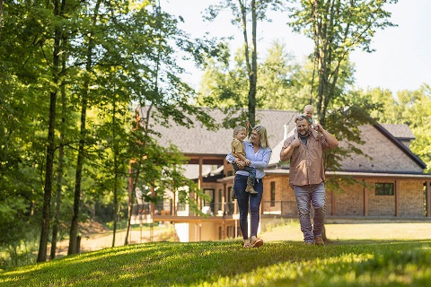 Couple walks on rural property financed by Rural 1st construction and land loans.
