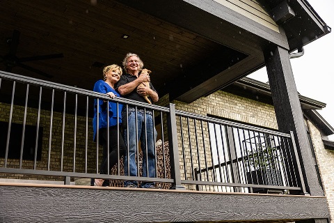 Rural 1st customers stand on porch of rural home in central Ohio.