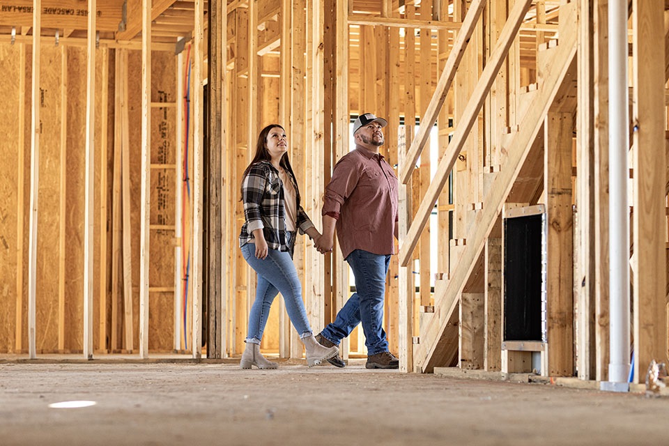 Couple walkthrough rural home construction financed by Rural 1st.