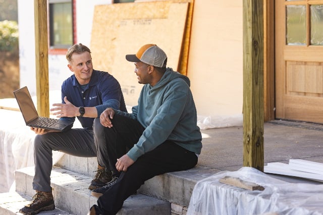 Loan officer meeting a construction site