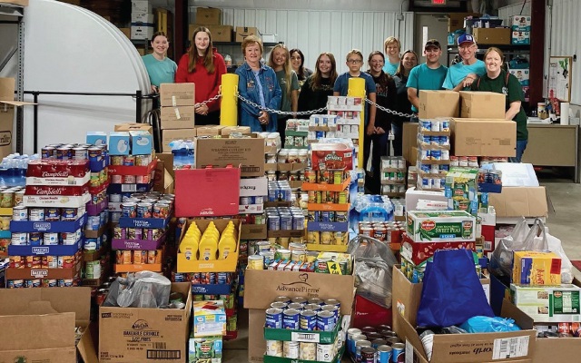 Group of volunteers with food donations.